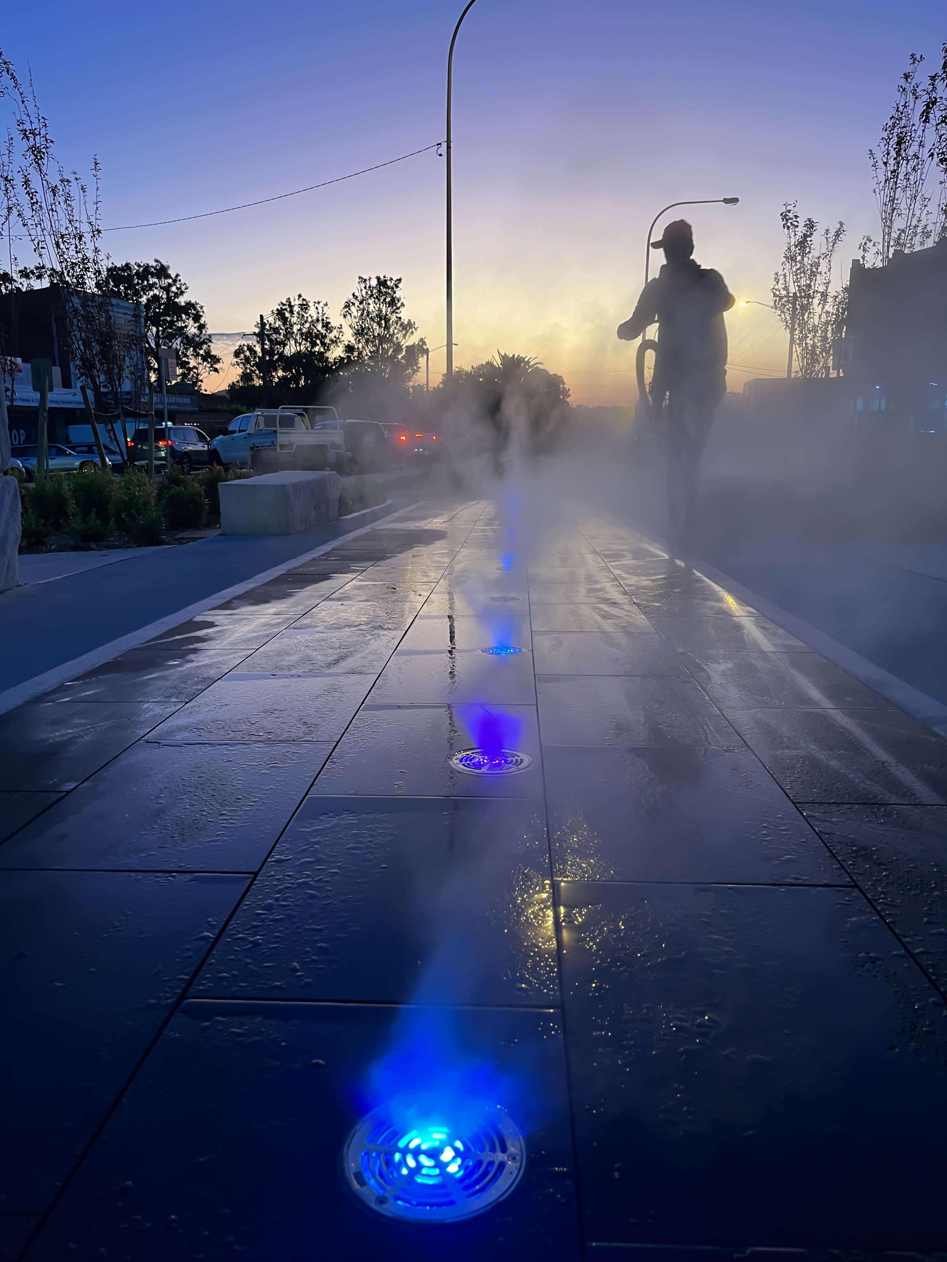 Flush-mount ground misting system in public precinct
