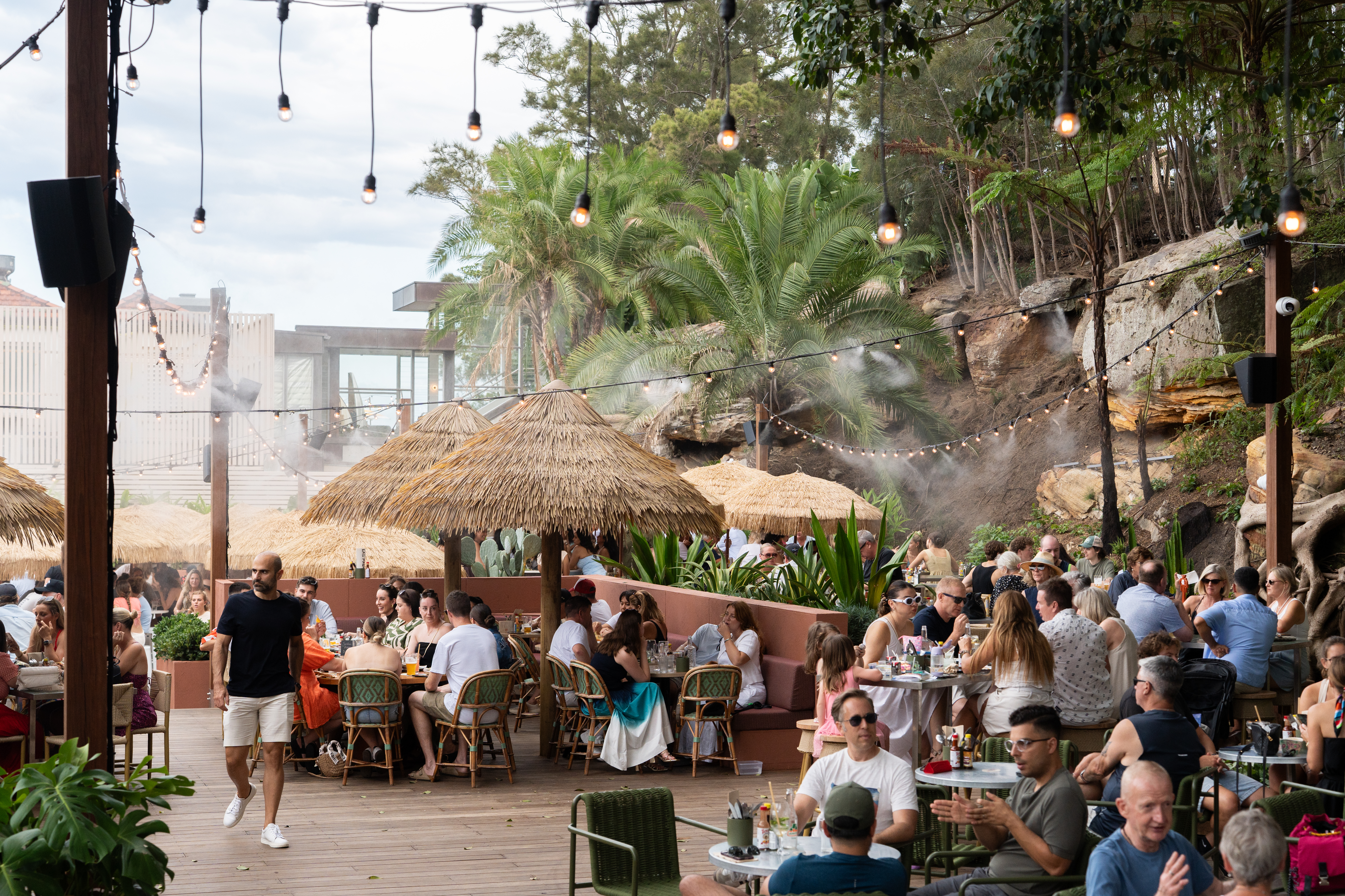 Catenary line misting system over outdoor dining
